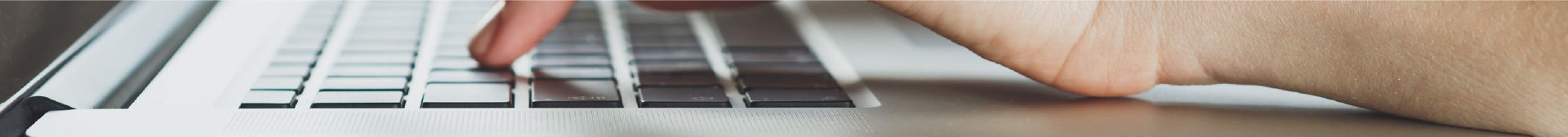 Contact Page Hero Image - Hands on a Keyboard Typing